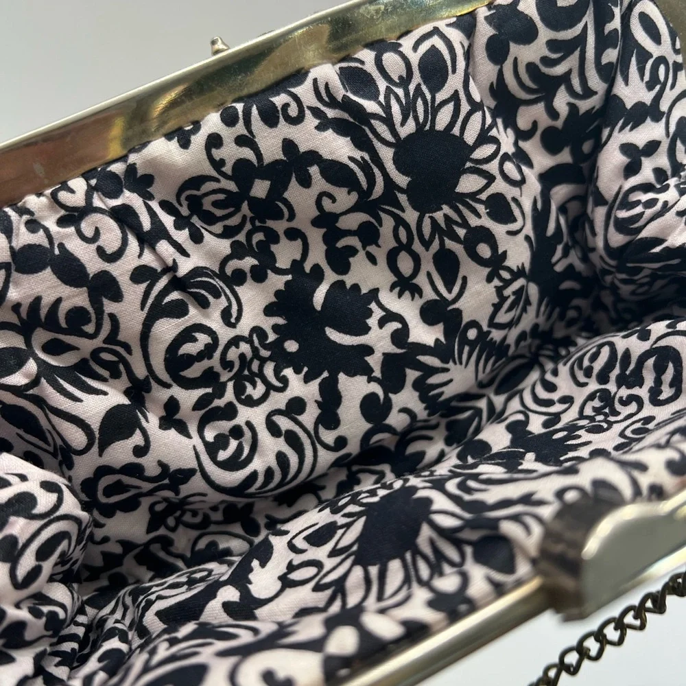 Vintage pair of white leather clutches, one is 70’s with great blk/white lining